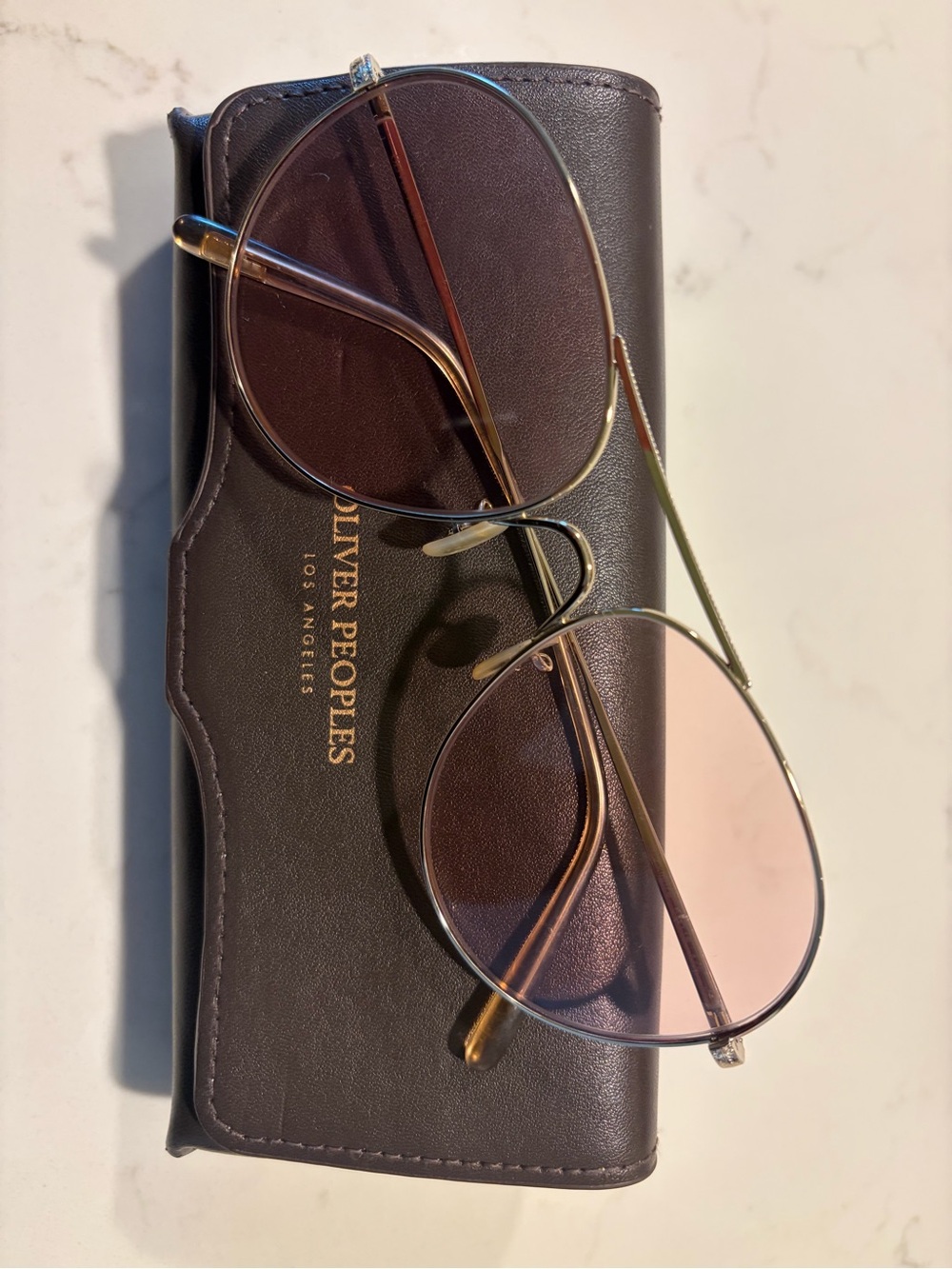 Oliver Peoples Gold Frame Sunglasses with Pink Lenses